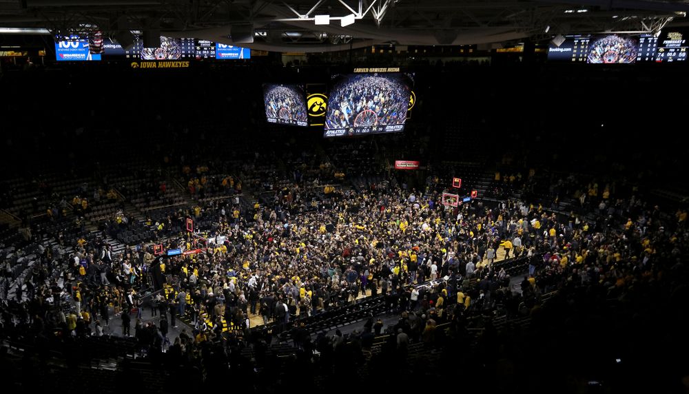 Fans storm the court after Iowa Hawkeyes defeated the Michigan Wolverines  Friday, February 1, 2019 at Carver-Hawkeye Arena. (Brian Ray/hawkeyesports.com)