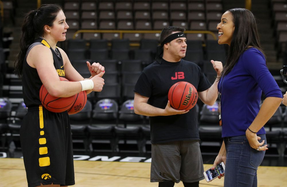 Iowa Hawkeyes forward Megan Gustafson (10), John Brickley, play- by-play for ESPN, and Christy Winters Scott, analyst for ESPN, talk together at a practice during the 2019 NCAA Women's Basketball Tournament at Carver Hawkeye Arena in Iowa City on Saturday, Mar. 23, 2019. (Stephen Mally for hawkeyesports.com)