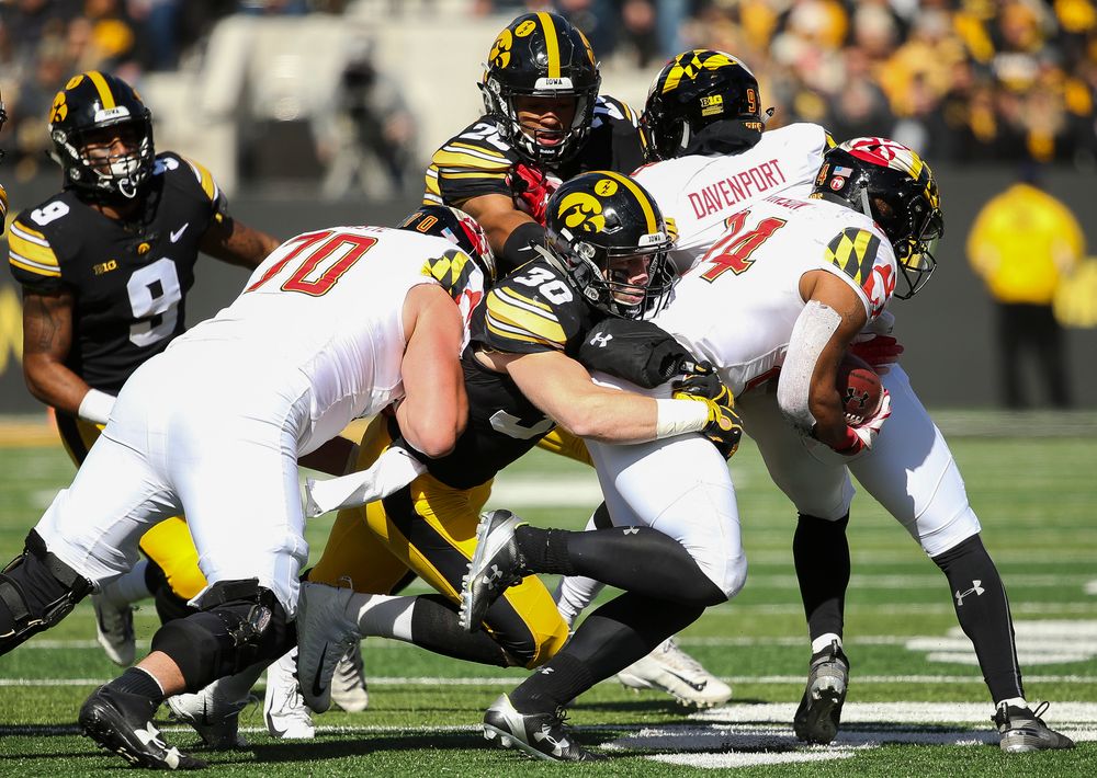 Iowa Hawkeyes defensive back Jake Gervase (30) makes a tackle during a game against Maryland at Kinnick Stadium on October 20, 2018. (Tork Mason/hawkeyesports.com)