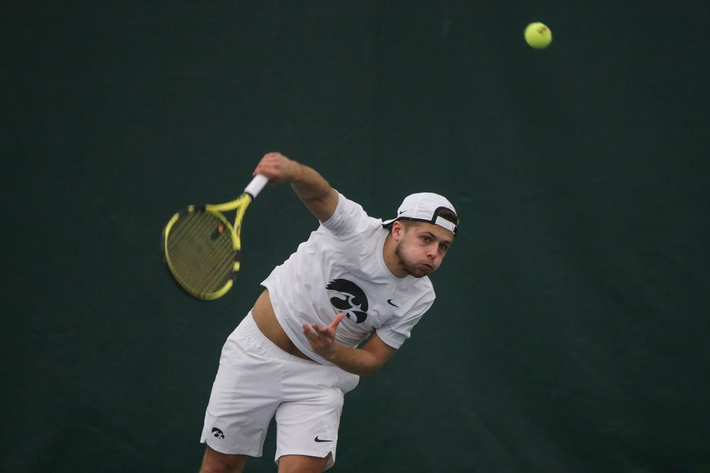 Iowa’s Will Davies serves the ball during the Iowa men’s tennis meet vs Nebraska on Sunday, March 1, 2020 at the Hawkeye Tennis and Recreation Complex. (Lily Smith/hawkeyesports.com)
