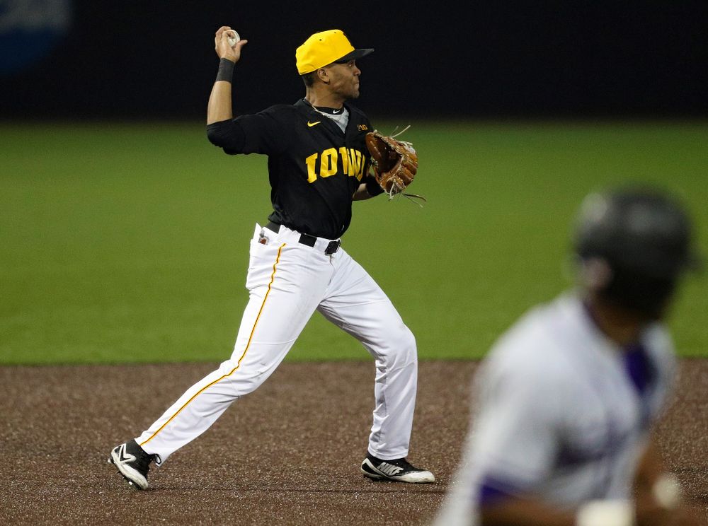 Iowa Hawkeyes third baseman Lorenzo Elion (1) throws to second base to start a double play during the seventh inning of their game against Western Illinois at Duane Banks Field in Iowa City on Wednesday, May. 1, 2019. (Stephen Mally/hawkeyesports.com)