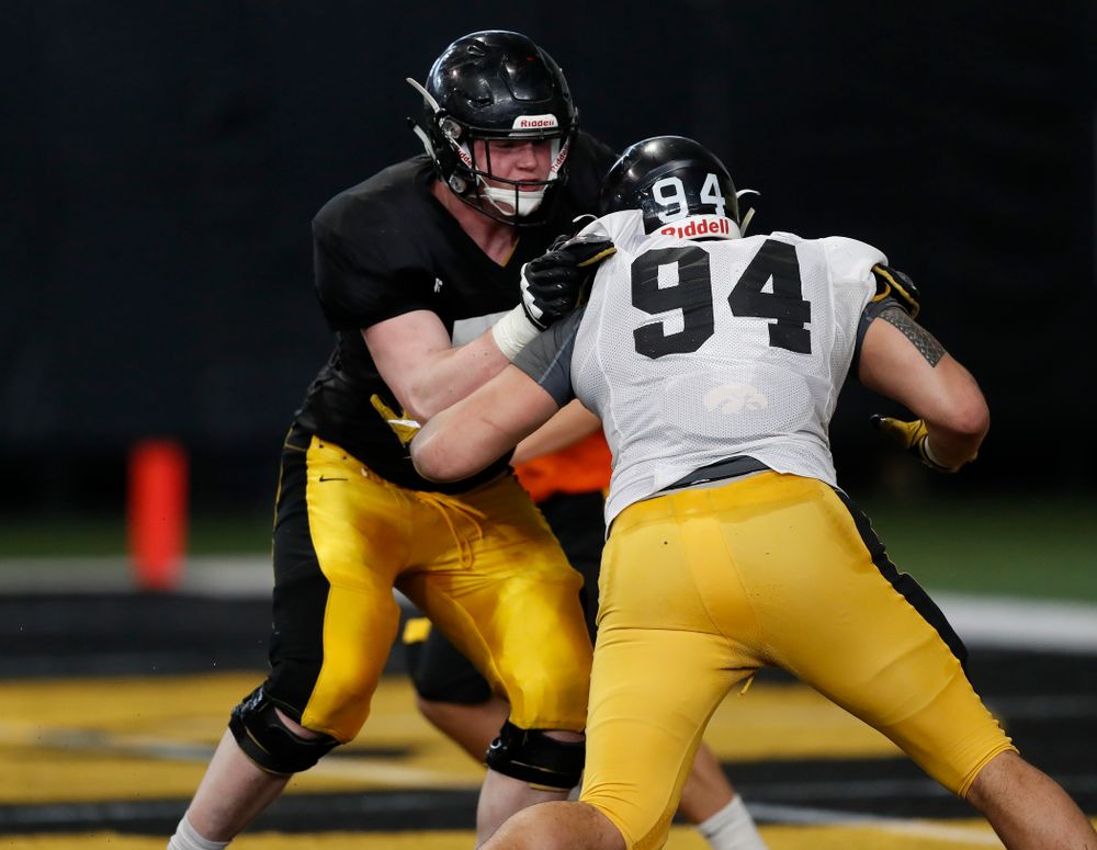 Iowa Hawkeyes defensive end A.J. Epenesa (94) and offensive lineman Mark Kallenberger (71) during spring practice Wednesday, March 28, 2018 at the Hansen Football Performance Center.  (Brian Ray/hawkeyesports.com)
