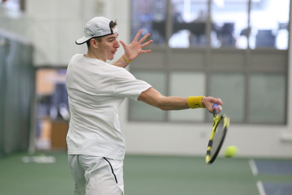Iowa’s Nikita Snezhko returns a hit during the Iowa men’s tennis meet vs Nebraska on Sunday, March 1, 2020 at the Hawkeye Tennis and Recreation Complex. (Lily Smith/hawkeyesports.com)