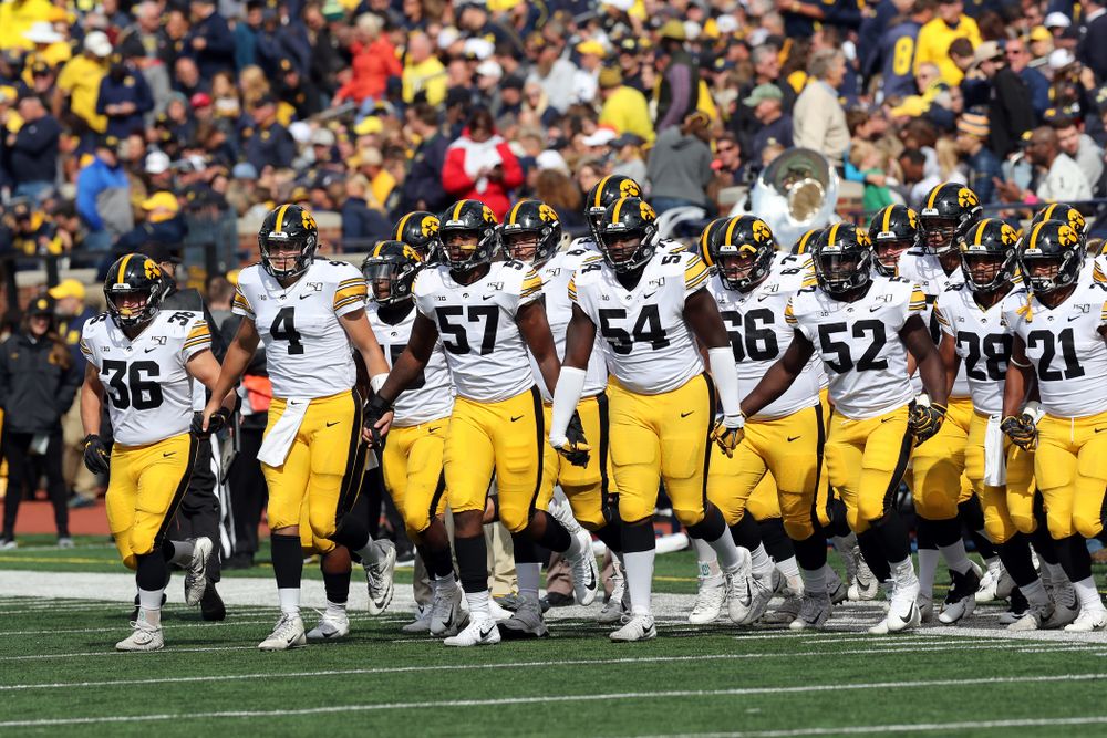The Iowa Hawkeyes swarm out for the second half against the Michigan Wolverines Saturday, October 5, 2019 at Michigan Stadium in Ann Arbor, MI. (Brian Ray/hawkeyesports.com)
