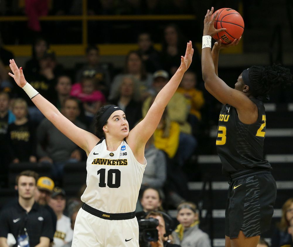 Iowa Hawkeyes center Megan Gustafson (10) tries to block a shot by Missouri Tigers guard Amber Smith (23) during the third quarter of their second round game in the 2019 NCAA Women's Basketball Tournament at Carver Hawkeye Arena in Iowa City on Sunday, Mar. 24, 2019. (Stephen Mally for hawkeyesports.com)