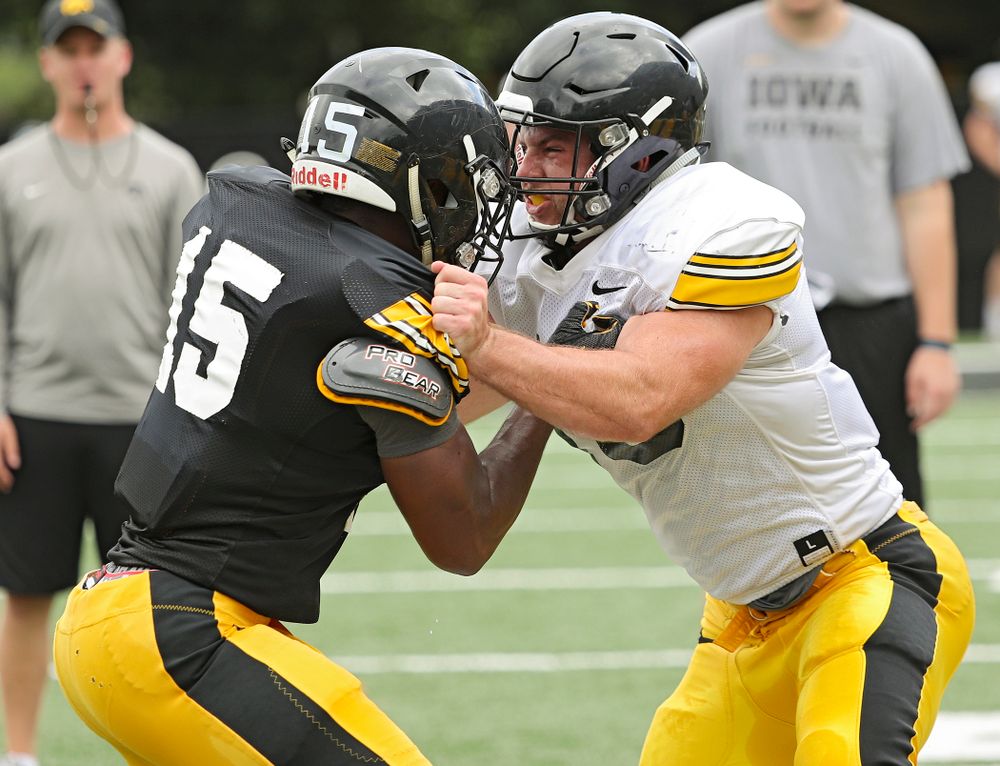 Iowa Hawkeyes running back Tyler Goodson (15) and linebacker Mike Timm (19) run a drill during Fall Camp Practice No. 10 at the Hansen Football Performance Center in Iowa City on Tuesday, Aug 13, 2019. (Stephen Mally/hawkeyesports.com)