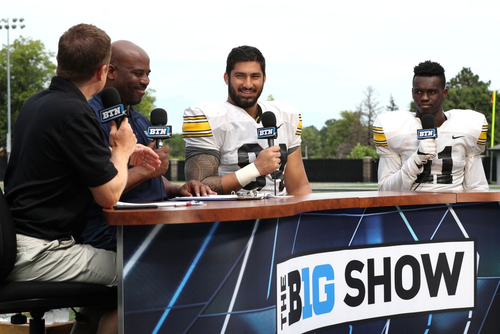 Iowa Hawkeyes defensive end A.J. Epenesa (94) and defensive back Michael Ojemudia (11) on the set of the BTN Tailgate Tour following fall camp Practice No. 16 Tuesday, August 20, 2019 at the Ronald D. and Margaret L. Kenyon Football Practice Facility. (Brian Ray/hawkeyesports.com)