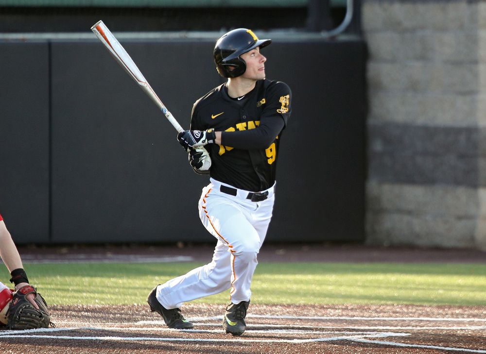 Iowa outfielder Ben Norman (9) drives a pitch for a hit during the first inning of their game at Duane Banks Field in Iowa City on Tuesday, March 3, 2020. (Stephen Mally/hawkeyesports.com)