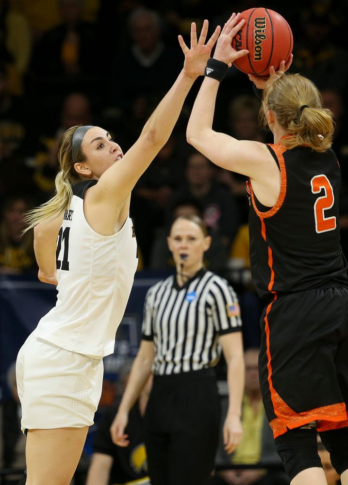 Iowa Hawkeyes forward Hannah Stewart (21) tries to block a shot by Mercer Bears forward Amanda Thompson (2) during the first round of the 2019 NCAA Women's Basketball Tournament at Carver Hawkeye Arena in Iowa City on Friday, Mar. 22, 2019. (Stephen Mally for hawkeyesports.com)