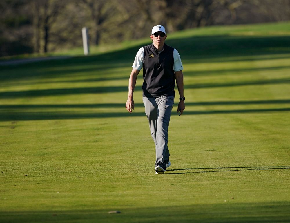 Iowa assistant coach Charlie Hoyle walks down the fairway during the second round of the Hawkeye Invitational at Finkbine Golf Course in Iowa City on Saturday, Apr. 20, 2019. (Stephen Mally/hawkeyesports.com)
