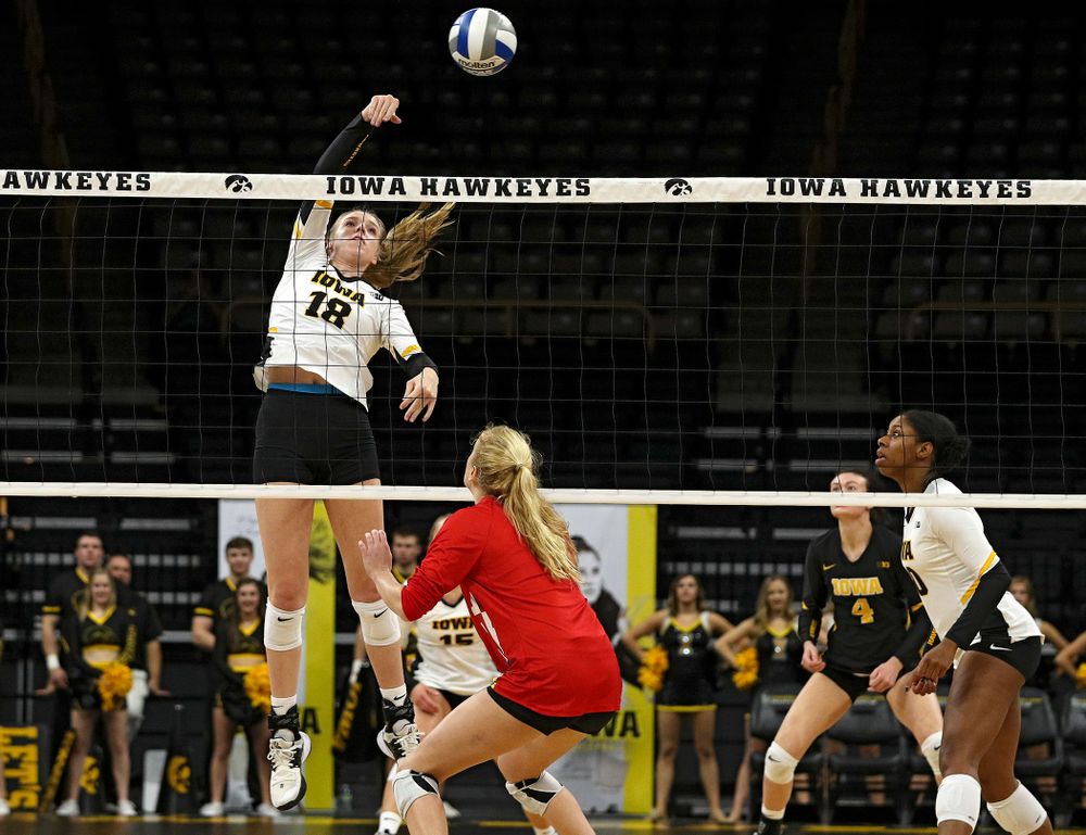Iowa’s Hannah Clayton (18) sends the ball over the net during the first set of their match at Carver-Hawkeye Arena in Iowa City on Saturday, Nov 30, 2019. (Stephen Mally/hawkeyesports.com)