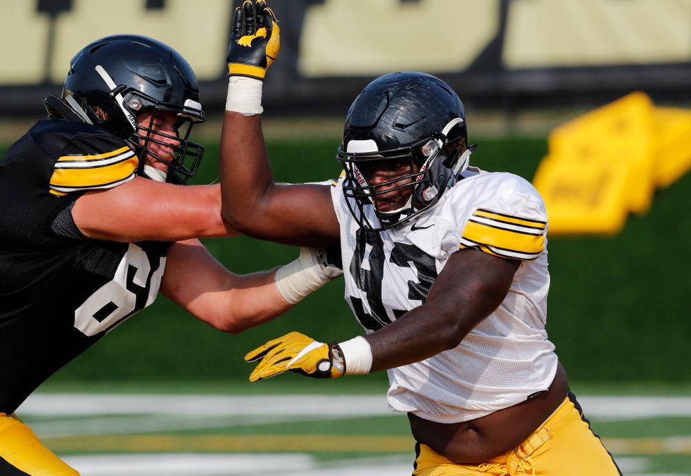 Iowa Hawkeyes defensive end Brandon Simon (93) and offensive lineman Levi Paulsen (66) during camp practice No. 16 Tuesday, August 21, 2018 at the Hansen Football Performance Center. (Brian Ray/hawkeyesports.com)