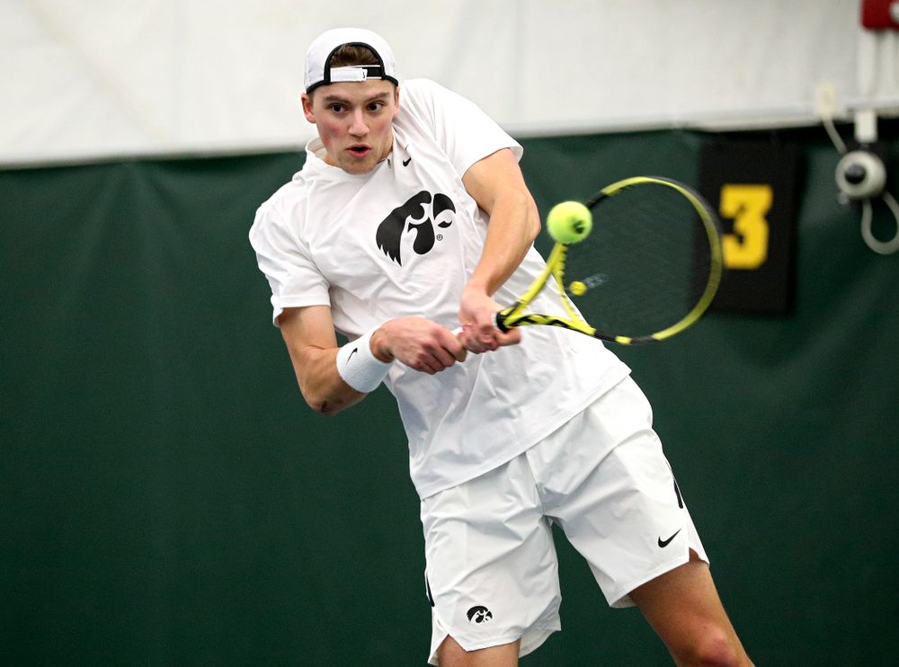 Iowa’s Joe Tyler returns a shot during his singles match at the Hawkeye Tennis and Recreation Complex in Iowa City on Sunday, February 16, 2020. (Stephen Mally/hawkeyesports.com)