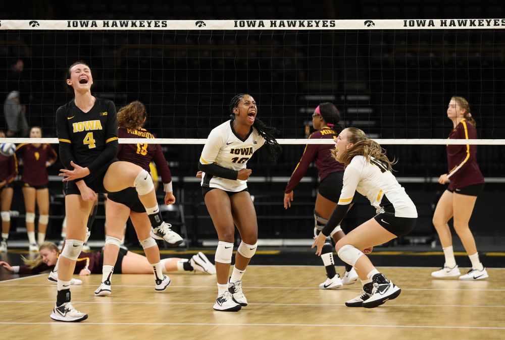 Iowa Hawkeyes outside hitter Griere Hughes (10) and defensive specialist Halle Johnston (4) against the Minnesota Golden Gophers Wednesday, October 2, 2019 at Carver-Hawkeye Arena. (Brian Ray/hawkeyesports.com)