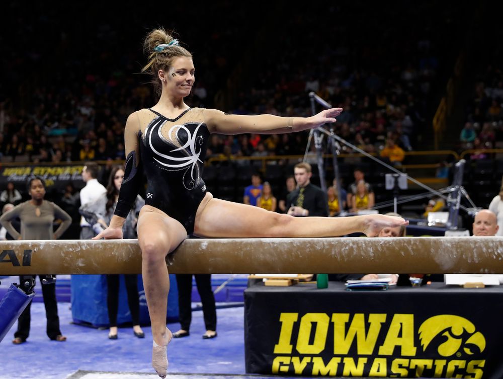 Iowa's Sydney Hogan competes on the beam against the Nebraska Cornhuskers 