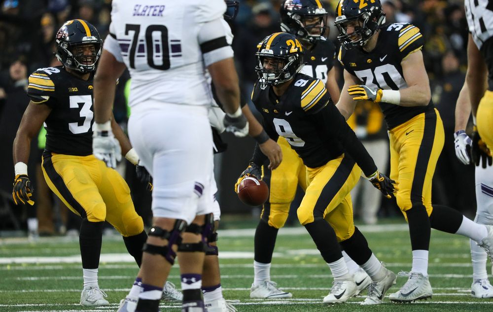 Iowa Hawkeyes defensive back Geno Stone (9) reacts after intercepting a pass during a game against Northwestern at Kinnick Stadium on November 10, 2018. (Tork Mason/hawkeyesports.com)