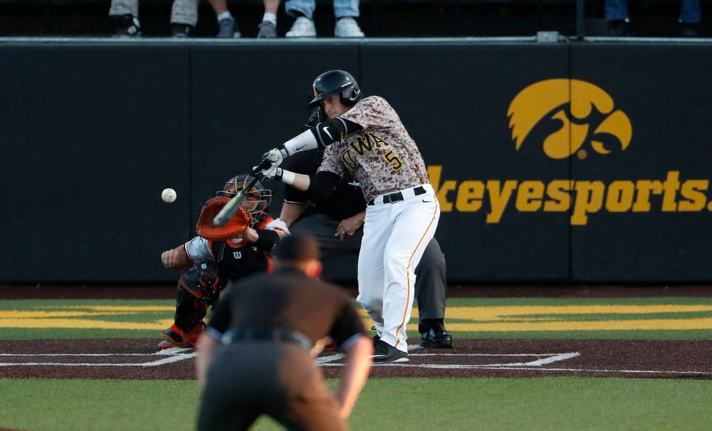 Iowa Hawkeyes catcher Tyler Cropley (5) hits a home run against Oklahoma State Friday, May 4, 2018 at Duane Banks Field. (Brian Ray/hawkeyesports.com)