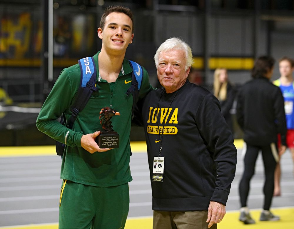 Larry Wieczorek hands out an award during the Larry Wieczorek Invitational at the Recreation Building in Iowa City on Saturday, January 18, 2020. (Stephen Mally/hawkeyesports.com)