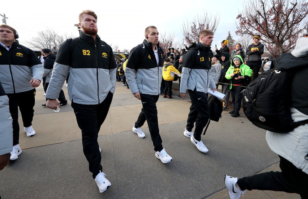 Iowa Hawkeyes quarterback Nate Stanley (4), defensive lineman John Waggoner (92), and wide receiver Henry Marchese (13) against the Illinois Fighting Illini Saturday, November 23, 2019 at Kinnick Stadium. (Brian Ray/hawkeyesports.com)