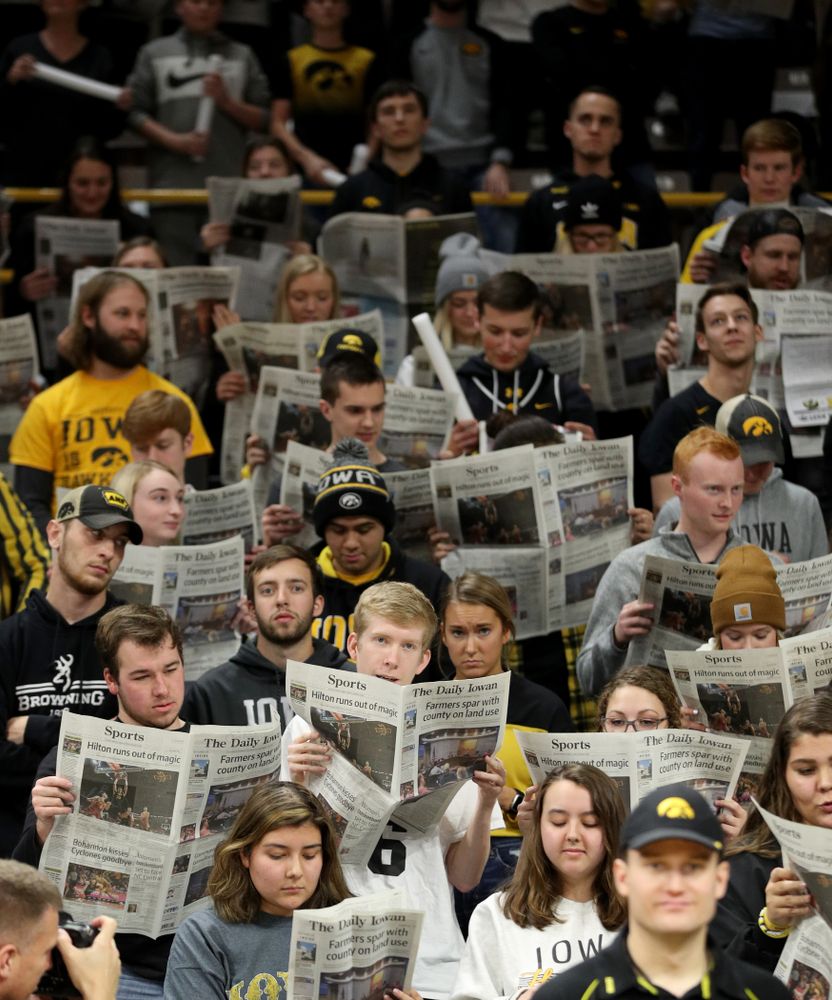 The Hawksnest reads copies of the Daily Iowan during introductions before the Iowa Hawkeyes game against the Michigan Wolverines Friday, January 17, 2020 at Carver-Hawkeye Arena. (Brian Ray/hawkeyesports.com)