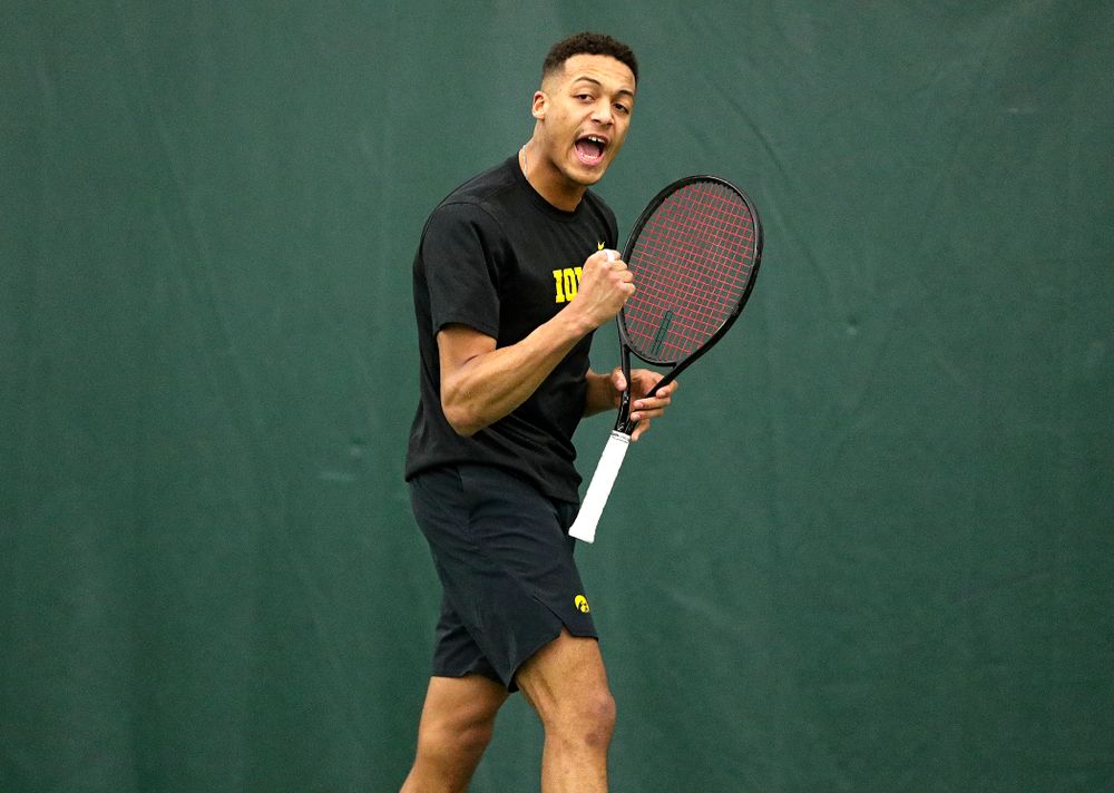 Iowa’s Oliver Okonkwo celebrates a point during his singles match at the Hawkeye Tennis and Recreation Complex in Iowa City on Friday, February 14, 2020. (Stephen Mally/hawkeyesports.com)