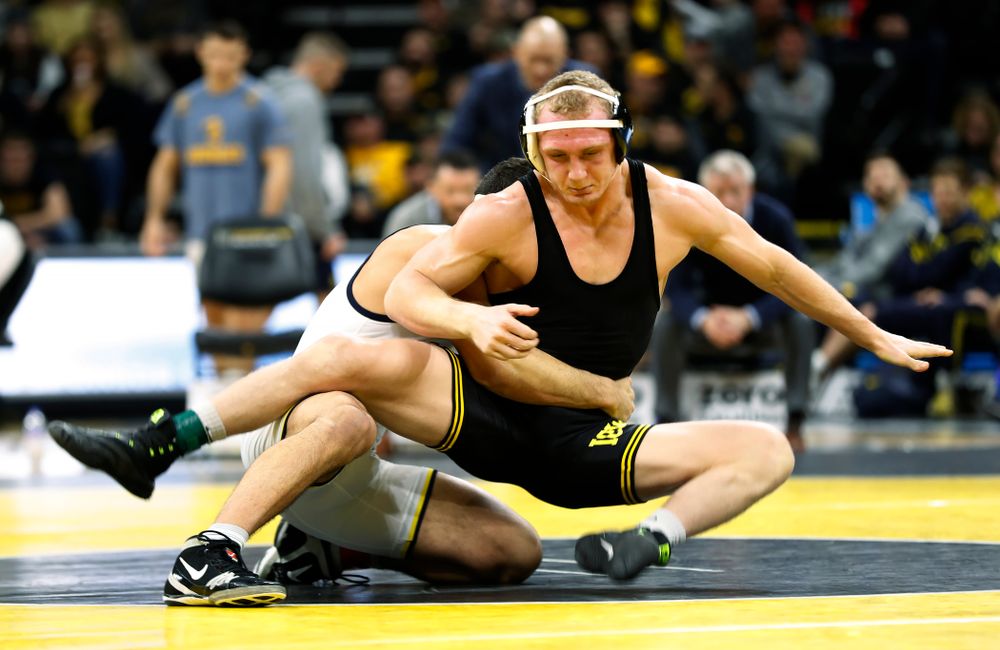 Iowa's Kaleb Young against Michigan's Myles Amine at 174 pounds 