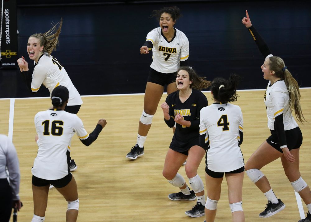 Iowa Hawkeyes middle blocker Hannah Clayton (18), Iowa Hawkeyes setter Brie Orr (7) and Iowa Hawkeyes defensive specialist Molly Kelly (1) celebrate after winning a point during a match against Penn State at Carver-Hawkeye Arena on November 3, 2018. (Tork Mason/hawkeyesports.com)