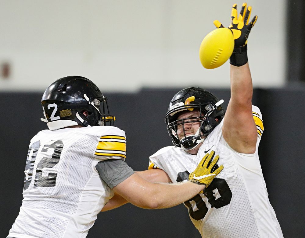 Iowa Hawkeyes defensive lineman Dalles Jacobus (66) knocks down a pass as he is blocked by defensive lineman John Waggoner (92) during Fall Camp Practice No. 9 at the Hansen Football Performance Center in Iowa City on Monday, Aug 12, 2019. (Stephen Mally/hawkeyesports.com)