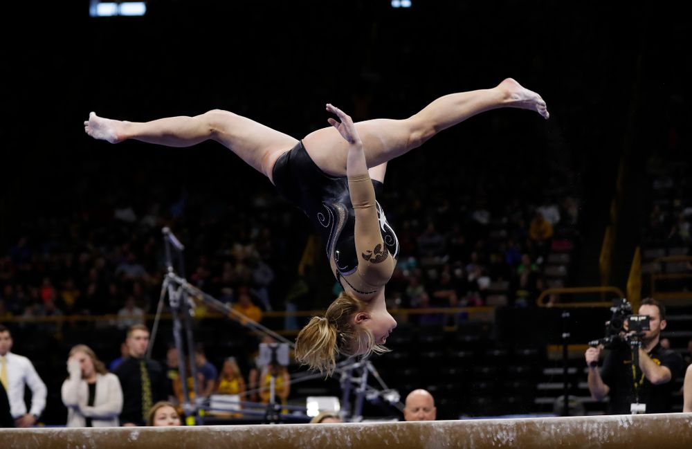 Iowa's Charlotte Sullivan competes on the beam against the Nebraska Cornhuskers 