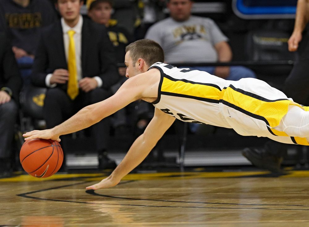 Iowa Hawkeyes guard Connor McCaffery (30) grabs a loose ball on the court for a turnover during the first half of their game at Carver-Hawkeye Arena in Iowa City on Friday, Nov 8, 2019. (Stephen Mally/hawkeyesports.com)
