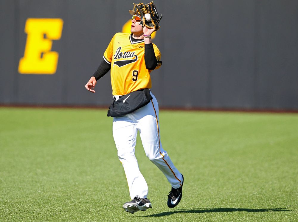 Iowa Hawkeyes right fielder Ben Norman (9) pulls in the ball for an out during the ninth inning against Illinois at Duane Banks Field in Iowa City on Sunday, Mar. 31, 2019. (Stephen Mally/hawkeyesports.com)