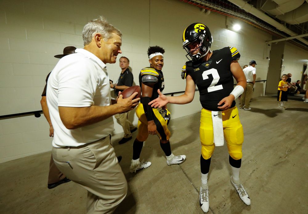 Iowa Hawkeyes quarterback Peyton Mansell (2) presents the ball from the final play against the Northern Illinois Huskies to head coach Kirk Ferentz Saturday, September 1, 2018 at Kinnick Stadium. (Brian Ray/hawkeyesports.com)