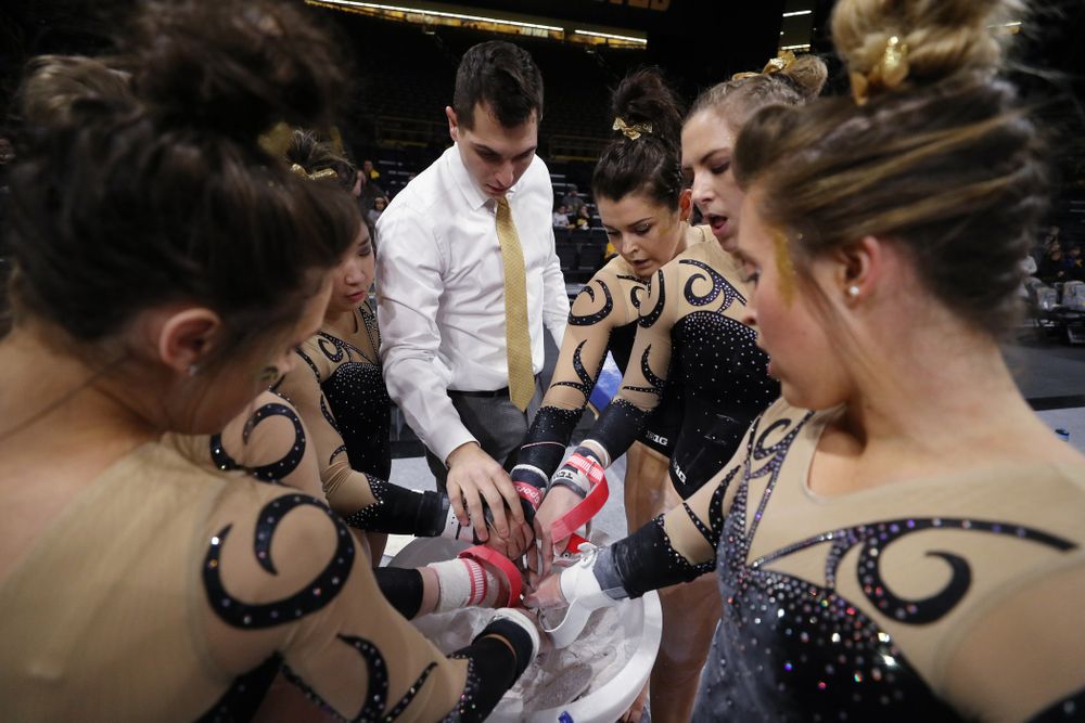 Iowa assistant coach Vince Smurro talks with his group before they compete on the bars during their meet against Southeast Missouri State Friday, January 11, 2019 at Carver-Hawkeye Arena. (Brian Ray/hawkeyesports.com)
