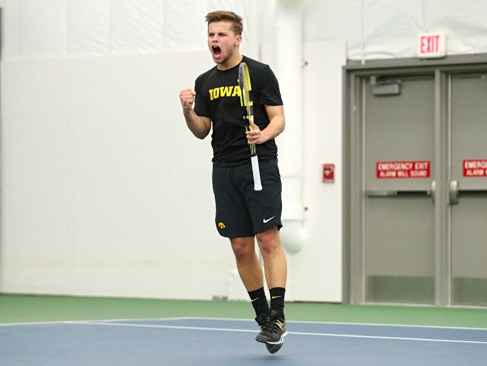 Iowa’s Will Davies celebrates after winning his singles match at the Hawkeye Tennis and Recreation Complex in Iowa City on Friday, February 14, 2020. (Stephen Mally/hawkeyesports.com)