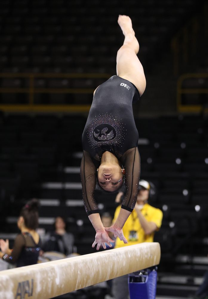 Iowa's Lauren Guerin competes on the bars during their meet against the Minnesota Golden Gophers Saturday, January 19, 2019 at Carver-Hawkeye Arena. (Brian Ray/hawkeyesports.com)