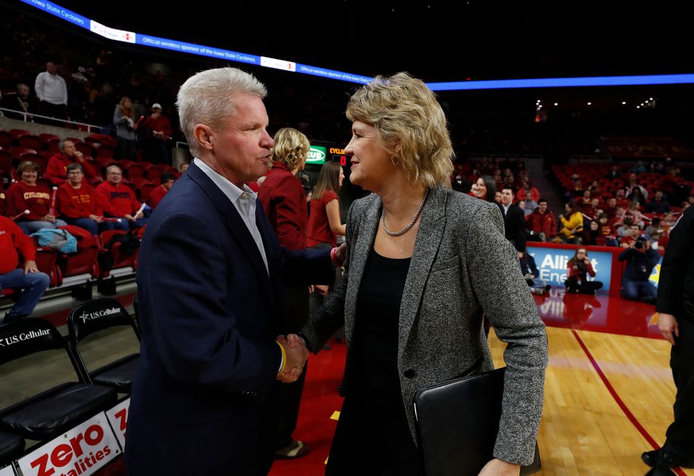 Iowa Hawkeyes head coach Lisa Bluder  and Iowa State Cyclones head coach Bill Fennelly 
