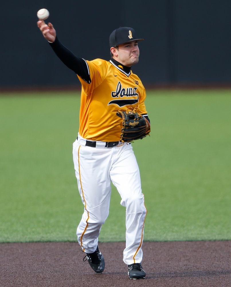 Iowa Hawkeyes infielder Kyle Crowl (23) throws to first base during a game against Evansville at Duane Banks Field on March 18, 2018. (Tork Mason/hawkeyesports.com)