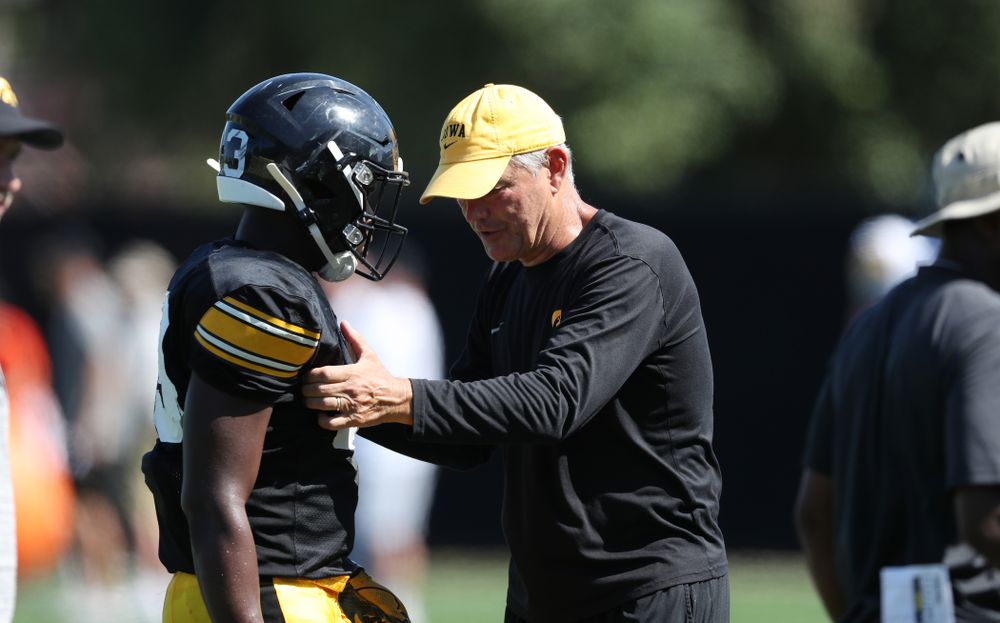 Iowa Hawkeyes head coach Kirk Ferentz and running back Shadrick Byrd (23) during Fall Camp Practice No. 5 Tuesday, August 6, 2019 at the Ronald D. and Margaret L. Kenyon Football Practice Facility. (Brian Ray/hawkeyesports.com)