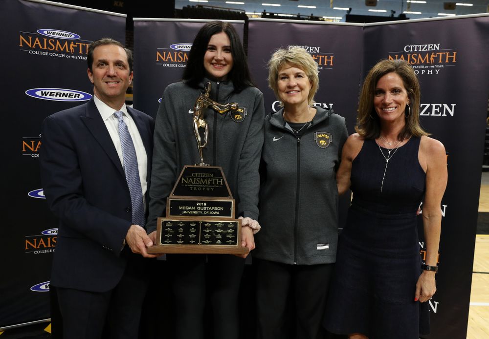 Iowa Hawkeyes forward Megan Gustafson (10) and head coach Lisa Bluder with the Naismith Player Of The Year Trophy during the teamÕs Celebr-Eight event Wednesday, April 24, 2019 at Carver-Hawkeye Arena. (Brian Ray/hawkeyesports.com)
