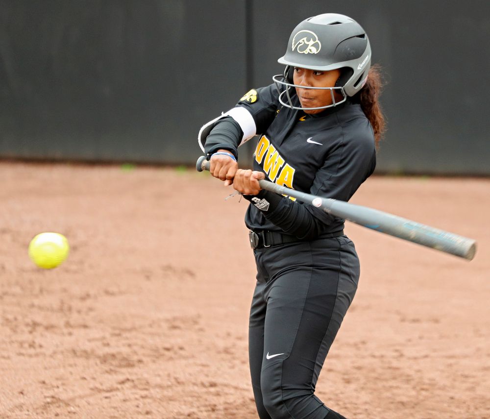 Iowa infielder Nia Carter (14) bats during the fourth inning of their game against Iowa Softball vs Indian Hills Community College at Pearl Field in Iowa City on Sunday, Oct 6, 2019. (Stephen Mally/hawkeyesports.com)