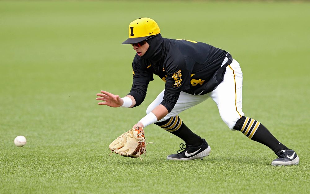 Iowa Hawkeyes second baseman Mitchell Boe (4) fields a ground ball during the first inning of their game against Illinois at Duane Banks Field in Iowa City on Saturday, Mar. 30, 2019. (Stephen Mally/hawkeyesports.com)