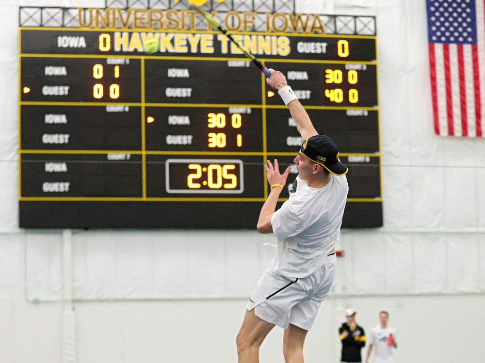 Iowa’s Nikita Snezhko returns a shot during his doubles match at the Hawkeye Tennis and Recreation Complex in Iowa City on Sunday, February 16, 2020. (Stephen Mally/hawkeyesports.com)