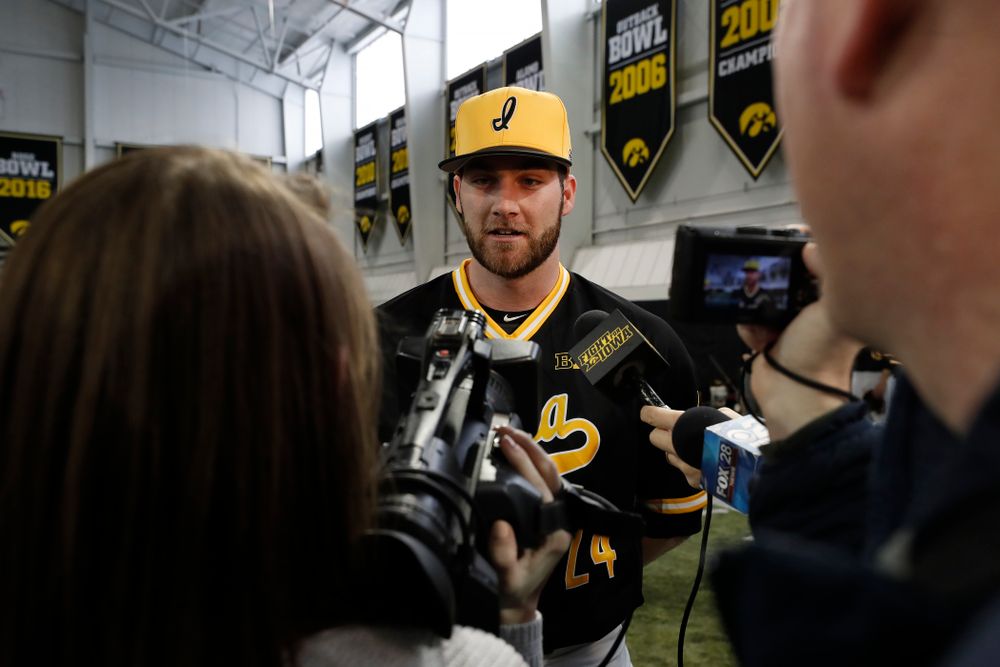Iowa Hawkeyes pitcher Nick Allgeyer (24) answers questions from reporters during the team's annual media day Thursday, February 8, 2018 in the indoor practice facility. (Brian Ray/hawkeyesports.com)