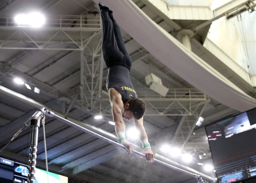 Iowa's Rogelio Vazquez competes on the high bar against the Ohio State Buckeyes Saturday, March 16, 2019 at Carver-Hawkeye Arena.  (Brian Ray/hawkeyesports.com)