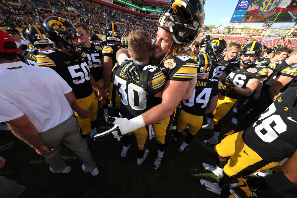 Iowa Hawkeyes defensive back Jake Gervase (30) and offensive lineman Landan Paulsen (68) during their Outback Bowl Tuesday, January 1, 2019 at Raymond James Stadium in Tampa, FL. (Brian Ray/hawkeyesports.com)