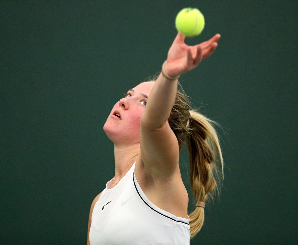 Iowa’s Danielle Burich serves during her singles match at the Hawkeye Tennis and Recreation Complex in Iowa City on Sunday, February 16, 2020. (Stephen Mally/hawkeyesports.com)