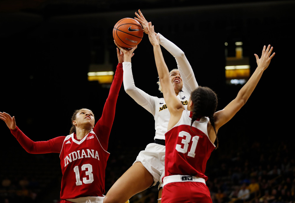 Iowa Hawkeyes forward Chase Coley (4) 