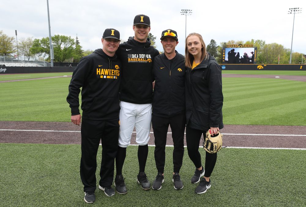 Iowa Hawkeyes Kyle Shimp (45) with senior managers T.J. Feldman, Jake Stone, and Haley Schulte before their game against Michigan State Sunday, May 12, 2019 at Duane Banks Field. (Brian Ray/hawkeyesports.com)