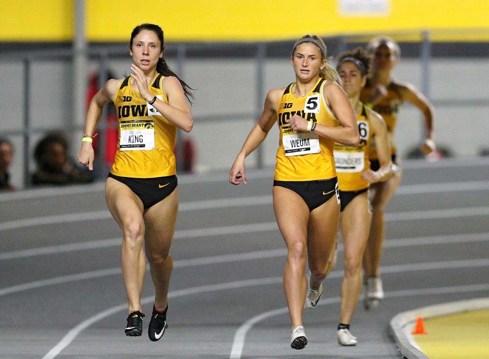 Iowa’s Mallory King (from left) and Aly Weum run the women’s 600 meter run event during the Jimmy Grant Invitational at the Recreation Building in Iowa City on Saturday, December 14, 2019. (Stephen Mally/hawkeyesports.com)