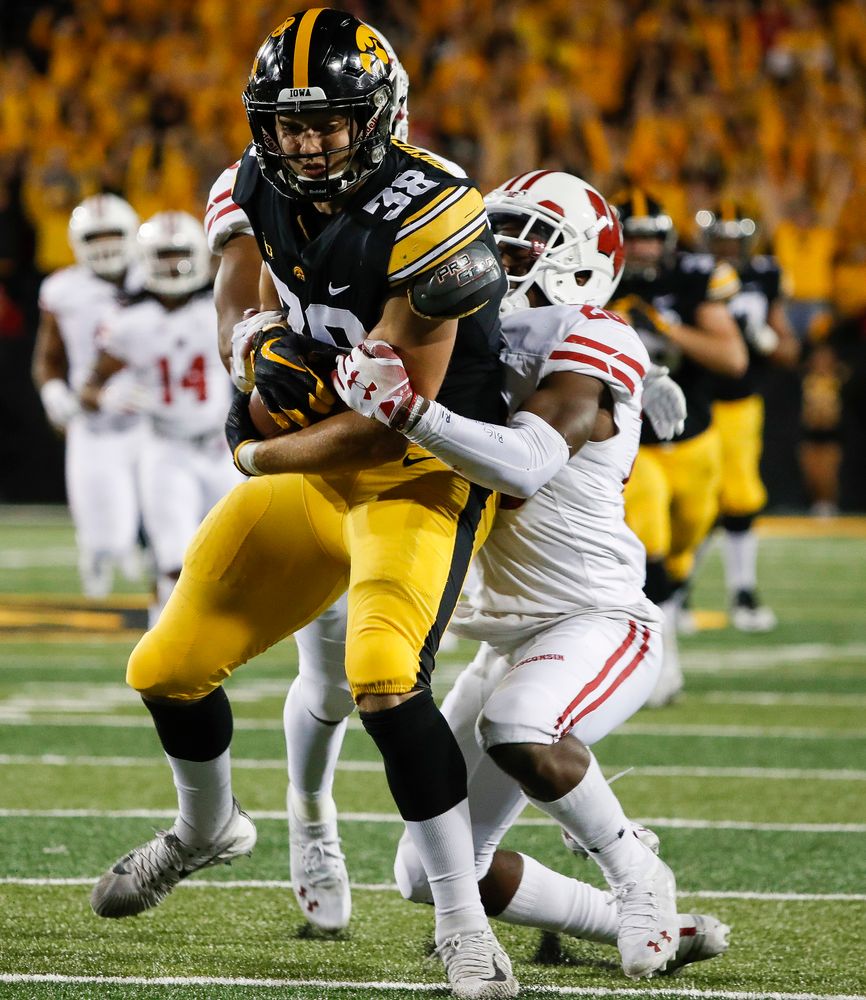 Iowa Hawkeyes tight end T.J. Hockenson (38) is tackled after making a first down reception during a game against Wisconsin at Kinnick Stadium on September 22, 2018. (Tork Mason/hawkeyesports.com)
